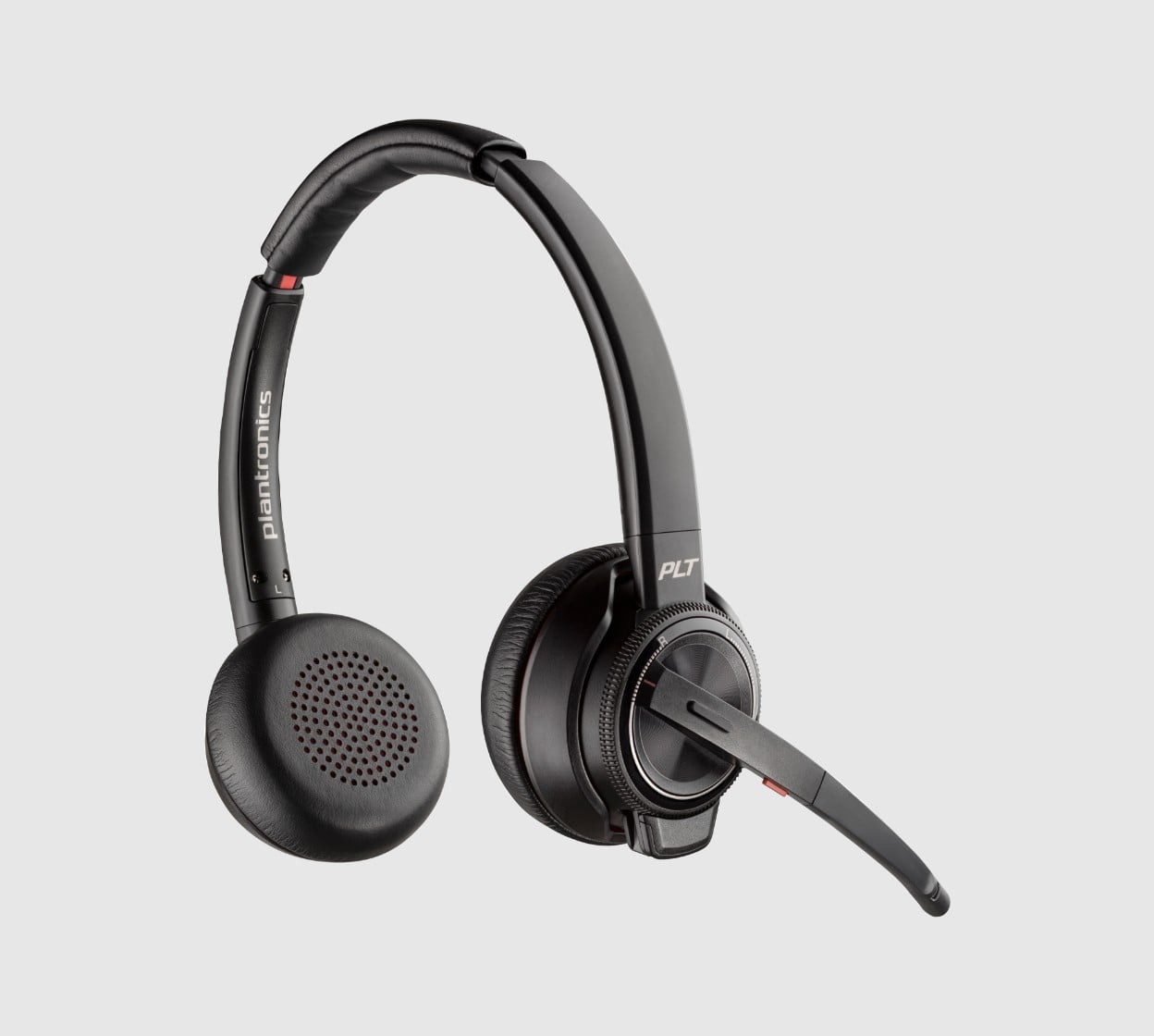 Poly Savi 8220 UC series DECT wireless headset on desktop base stand with multi device connectivity  and volume controls